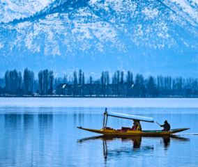 shikara in dal lake in a snowy season