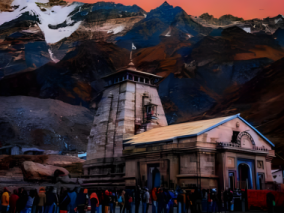 Kedarnath Temple nestled in the mountains, with several individuals standing in the line for worship, appreciating the natural beauty of the area.